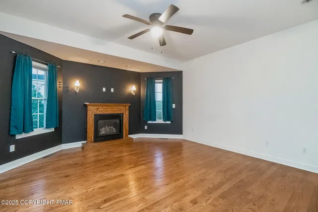a bathroom with a shower a mirror and a sink