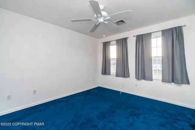 a view of empty room with workspace