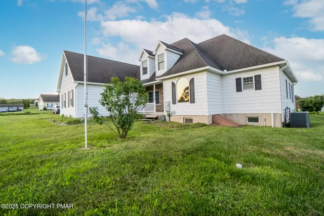 a house that is sitting in the grass