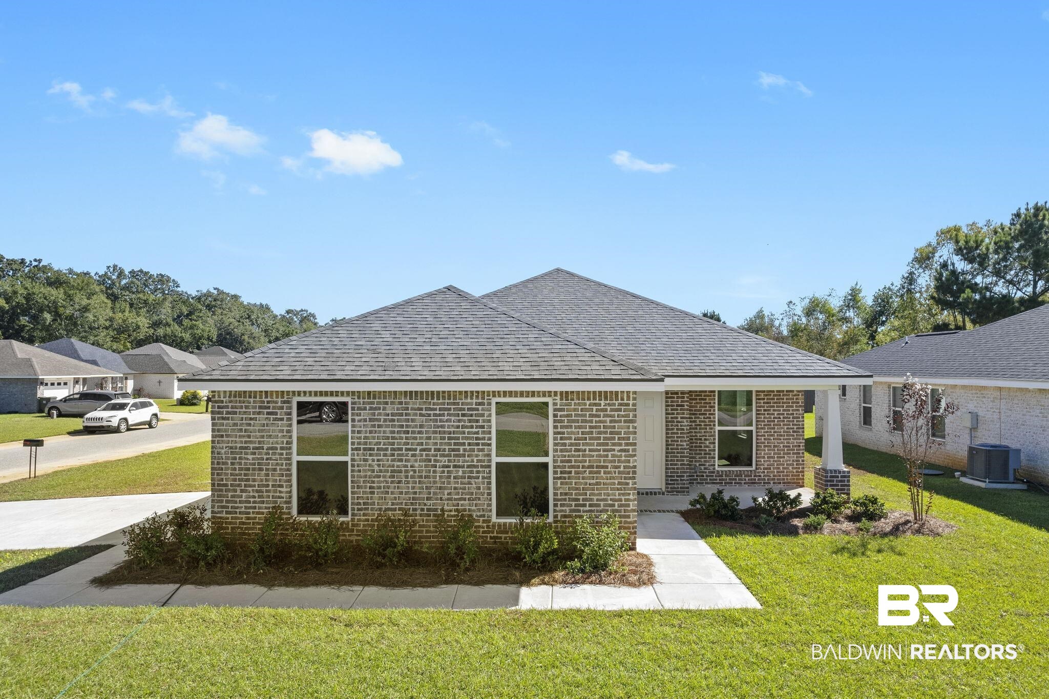 16014 Alabama Avenue Silverhill, AL 36576 - Photo 42 of 50 Rear view of house with a yard