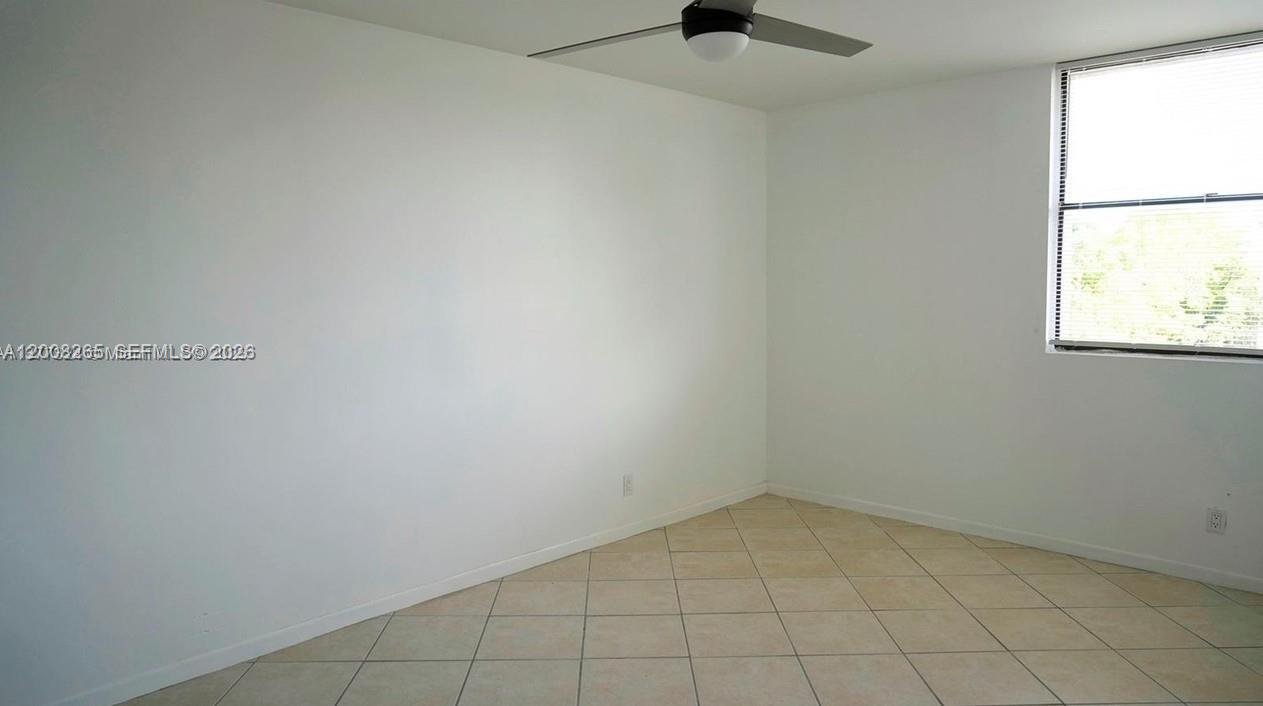 2771 Riverside Drive, Unit 405A Coral Springs, FL 33065 - Photo 12 of 19 an empty room with a window