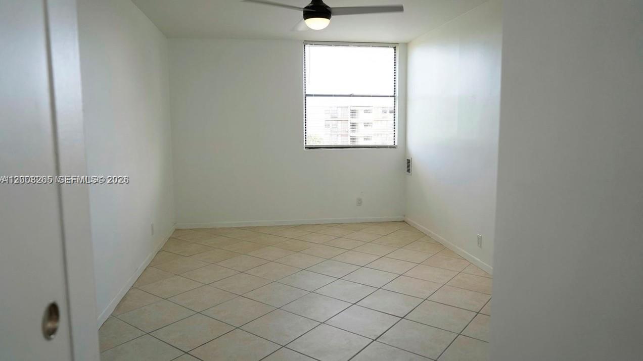 2771 Riverside Drive, Unit 405A Coral Springs, FL 33065 - Photo 13 of 19 an empty room with windows