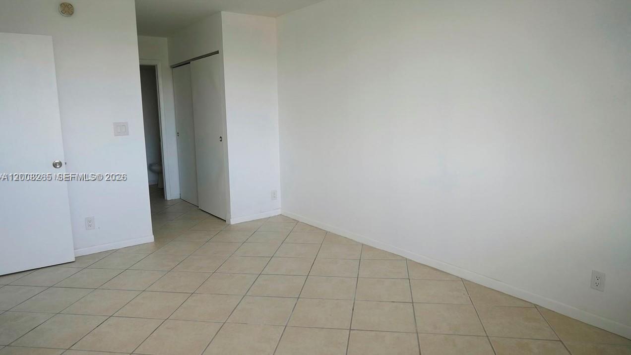 2771 Riverside Drive, Unit 405A Coral Springs, FL 33065 - Photo 15 of 19 an empty room with cabinet