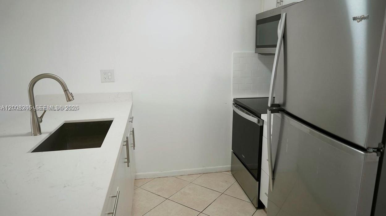 2771 Riverside Drive, Unit 405A Coral Springs, FL 33065 - Photo 3 of 19 a close view of a sink and cabinets