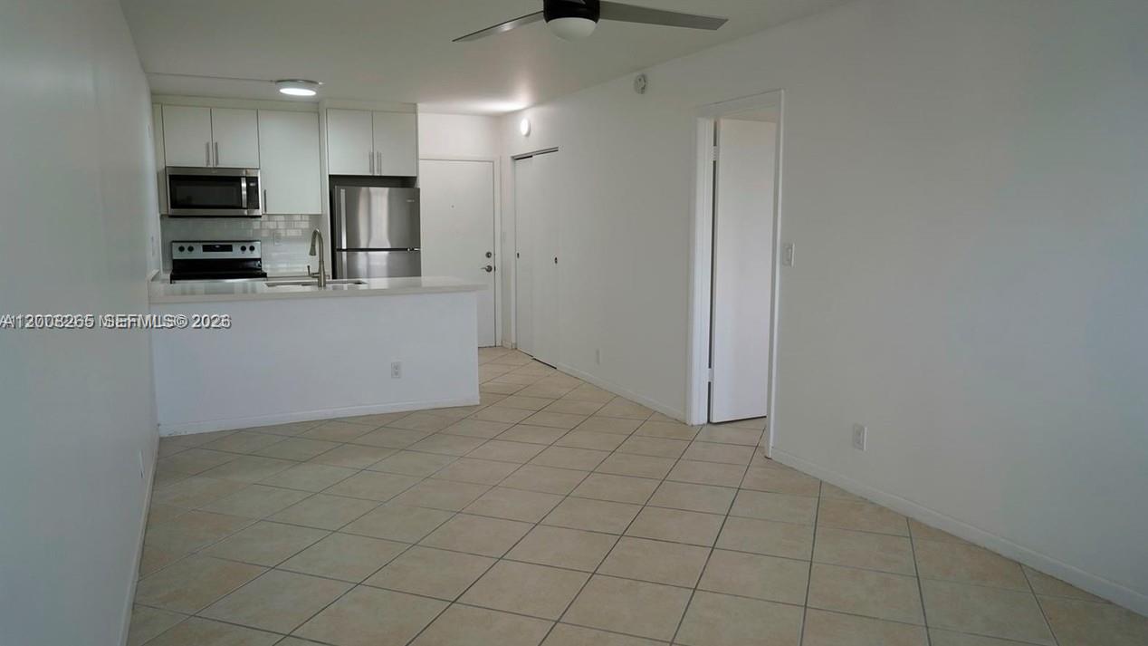 2771 Riverside Drive, Unit 405A Coral Springs, FL 33065 - Photo 6 of 19 a view of a kitchen with electric appliances