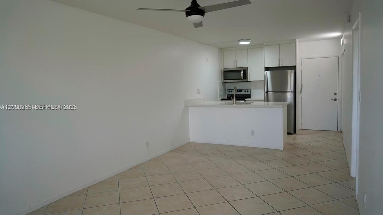 2771 Riverside Drive, Unit 405A Coral Springs, FL 33065 - Photo 8 of 19 a view of a kitchen with a sink