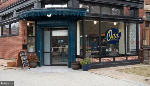 a view of a shop in a street