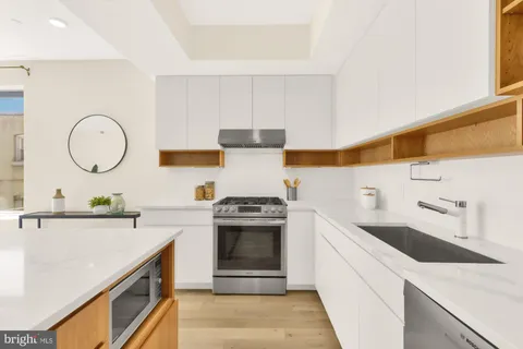 a kitchen with a sink and a stove