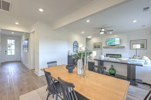 a view of a dining room with furniture window and wooden floor
