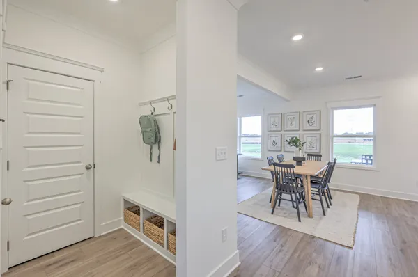 a view of a dining room with furniture window and wooden floor