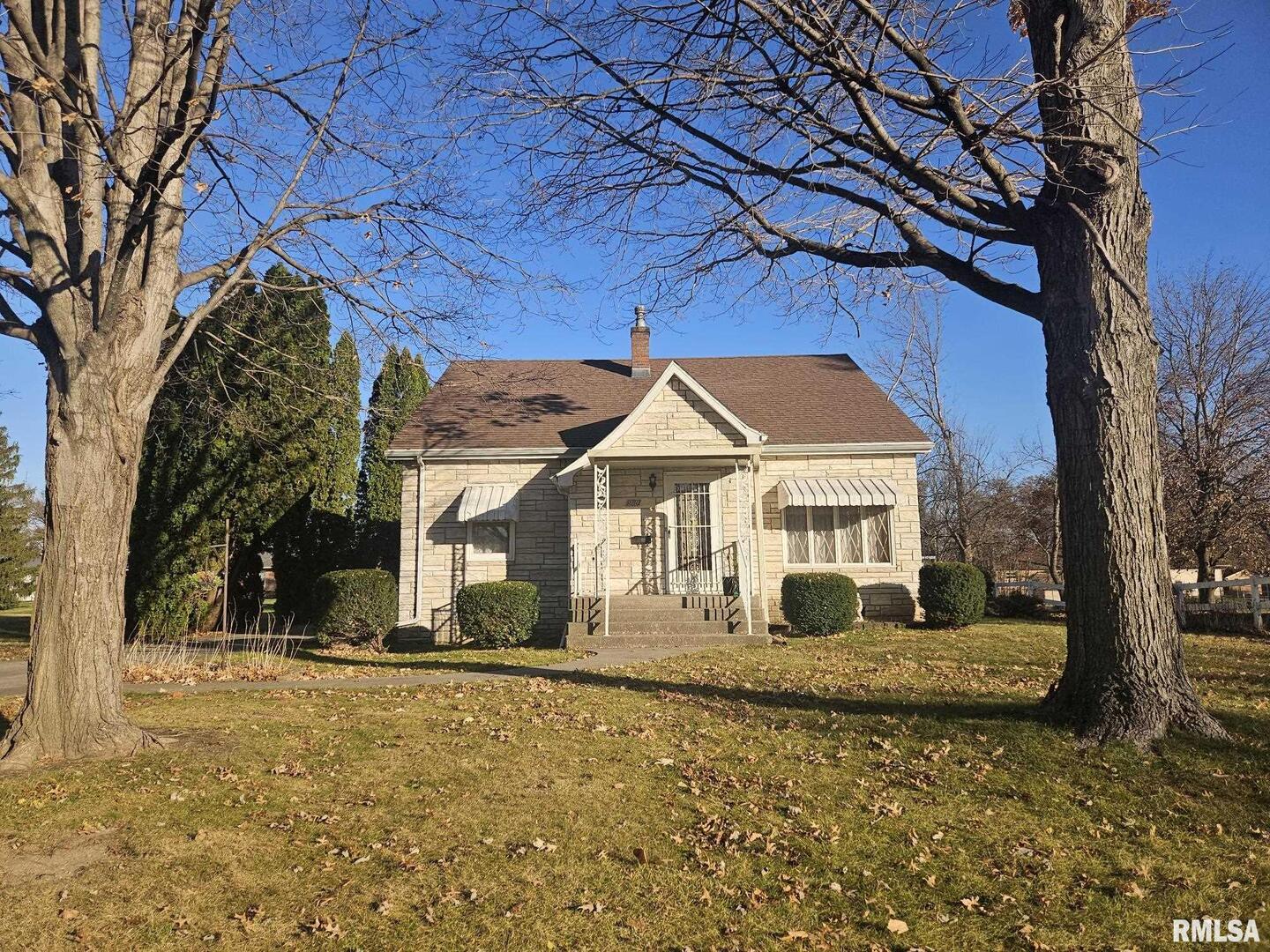 918 Seminary Street Wilton, IA 52778 - Photo 1 of 12 a house with trees in front of it