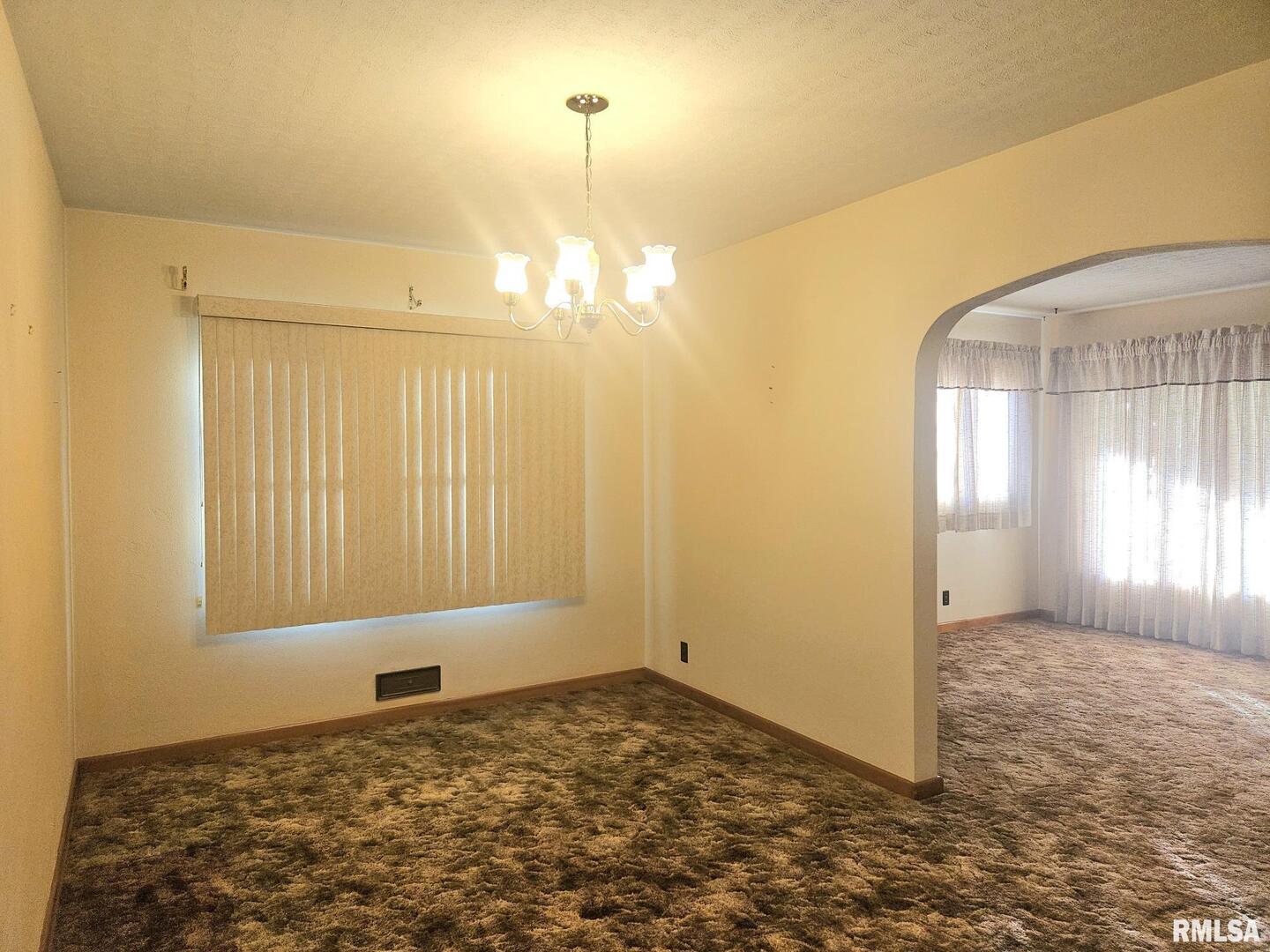 918 Seminary Street Wilton, IA 52778 - Photo 8 of 12 a view of a livingroom with a staircase