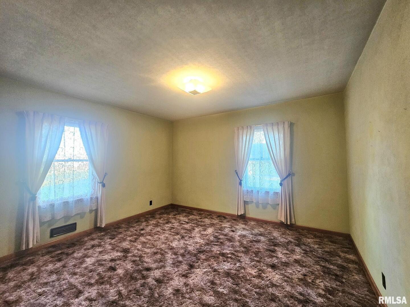 918 Seminary Street Wilton, IA 52778 - Photo 10 of 12 a view of an empty room and window