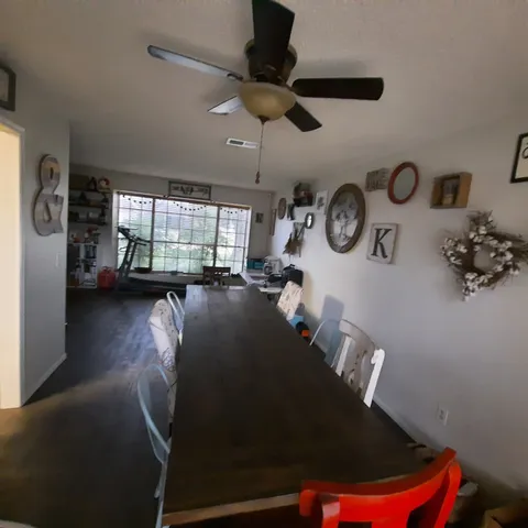 a view of a hallway with seating space