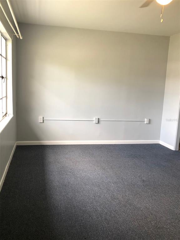 1401 East Alfred Street, Unit 3 Tavares, FL 32778 - Photo 3 of 10 a view of a room with an empty space