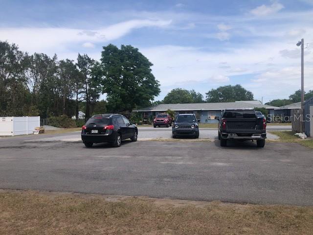 1401 East Alfred Street, Unit 3 Tavares, FL 32778 - Photo 9 of 10 a view of street with parked cars