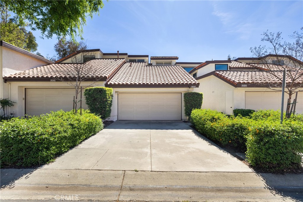 832 Trinity Lane Claremont, CA 91711 - Photo 1 of 51 a front view of a house with a garden