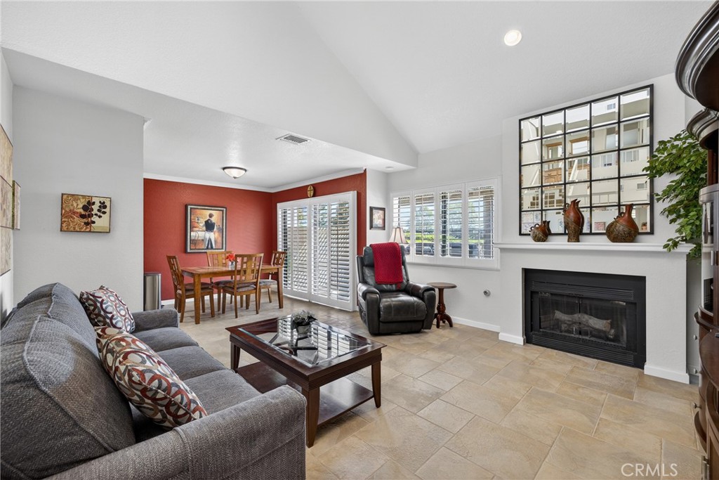 832 Trinity Lane Claremont, CA 91711 - Photo 13 of 51 a living room with furniture a fireplace and a large window