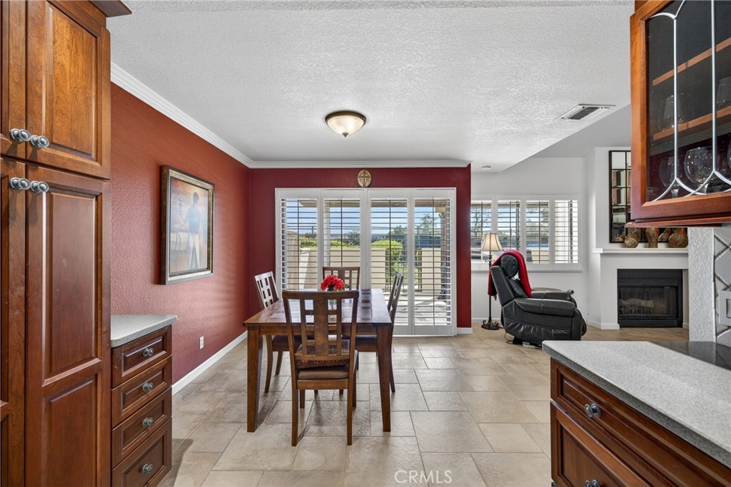 832 Trinity Lane Claremont, CA 91711 - Photo 16 of 51 a living room with furniture a fireplace and a flat screen tv