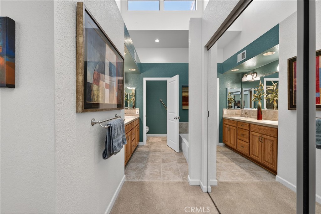 832 Trinity Lane Claremont, CA 91711 - Photo 30 of 51 a bathroom with a double vanity sink and mirror