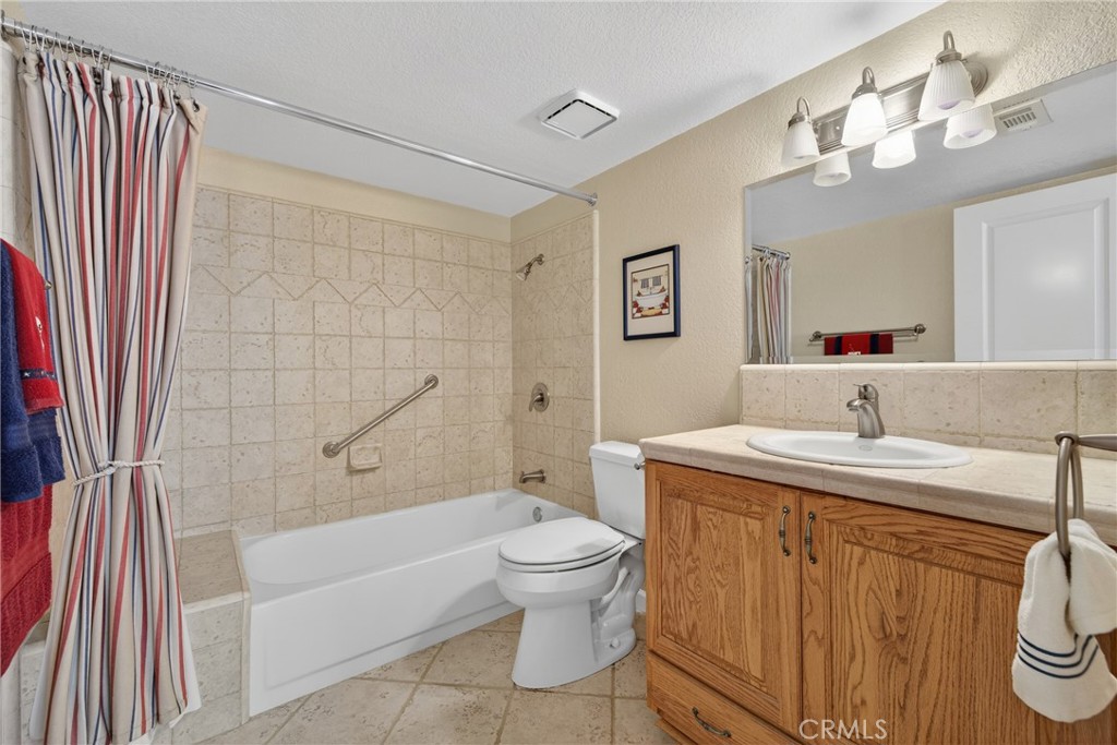 832 Trinity Lane Claremont, CA 91711 - Photo 35 of 51 a bathroom with a sink a toilet and a mirror