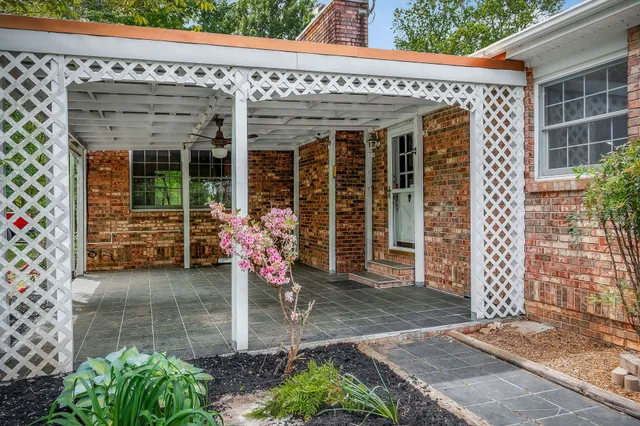 a view of a lake with houses in the back