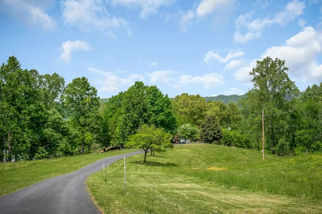 a view of a room with a window and ceiling fan