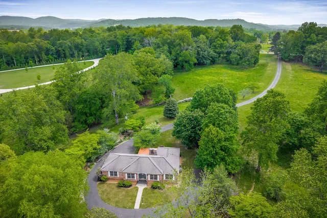 a view of a lake with houses in the back