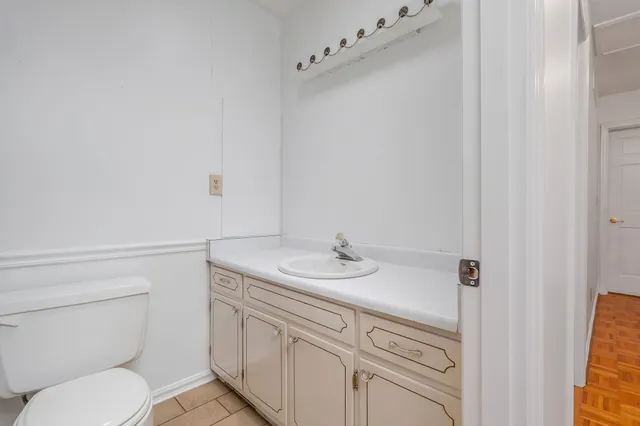 a kitchen with stainless steel appliances granite countertop a sink a stove top oven a counter space and cabinets