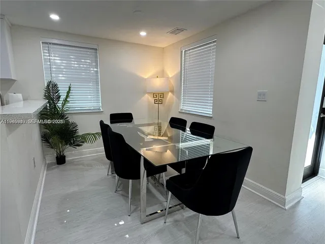 a view of a dining room with furniture