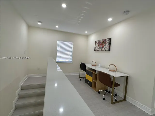 a bathroom with a shower a sink a toilet and mirror