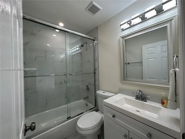 a bedroom with a bed and a fireplace