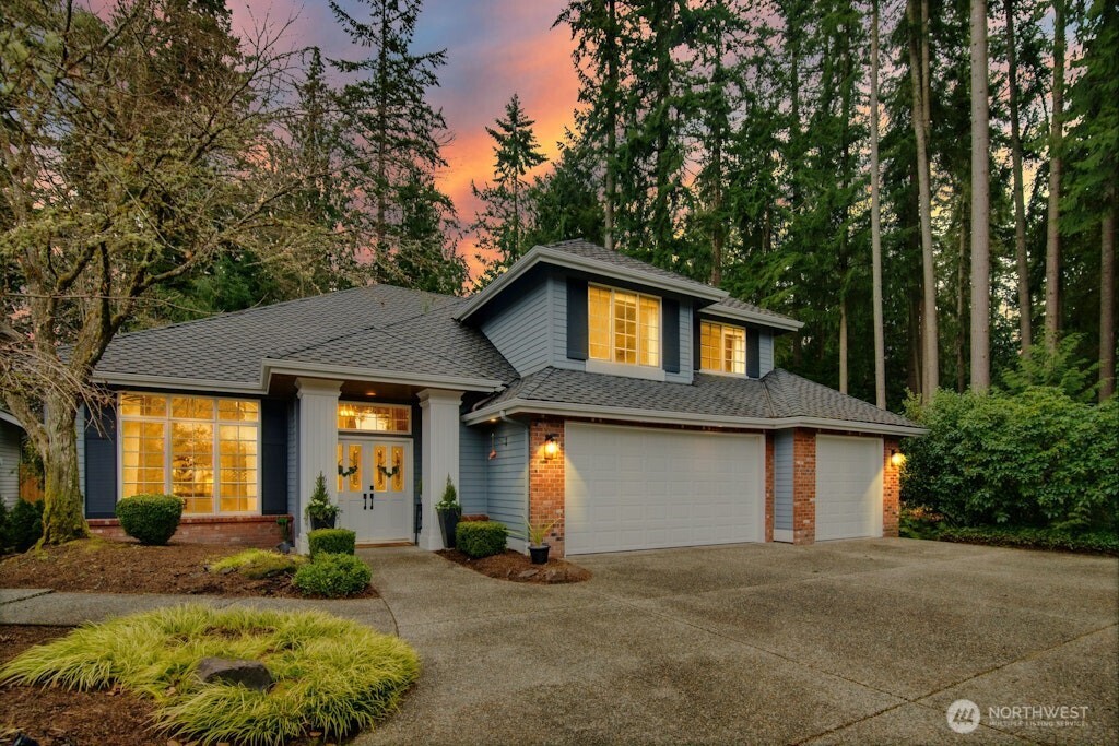 3020 215th Street Southeast Bothell, WA 98021 - Photo 1 of 35 a front view of a house with garden