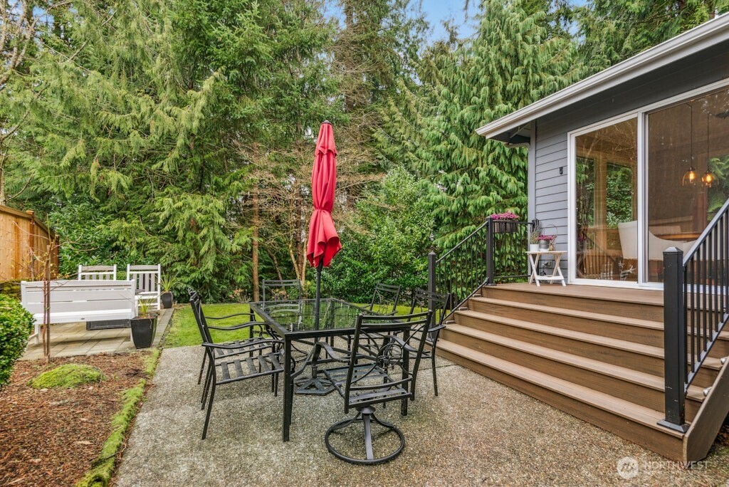 3020 215th Street Southeast Bothell, WA 98021 - Photo 29 of 35 a front view of a house with sitting area and garden