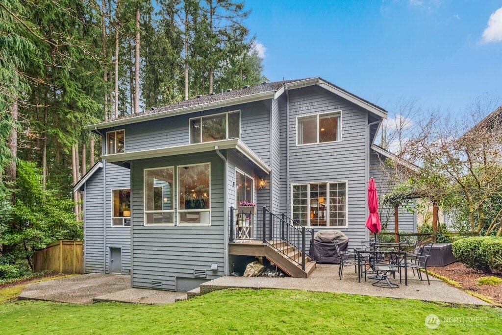3020 215th Street Southeast Bothell, WA 98021 - Photo 32 of 35 a view of a house with a yard chairs and a table