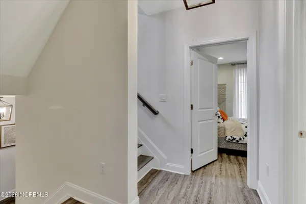 a view of an entryway with wooden floor