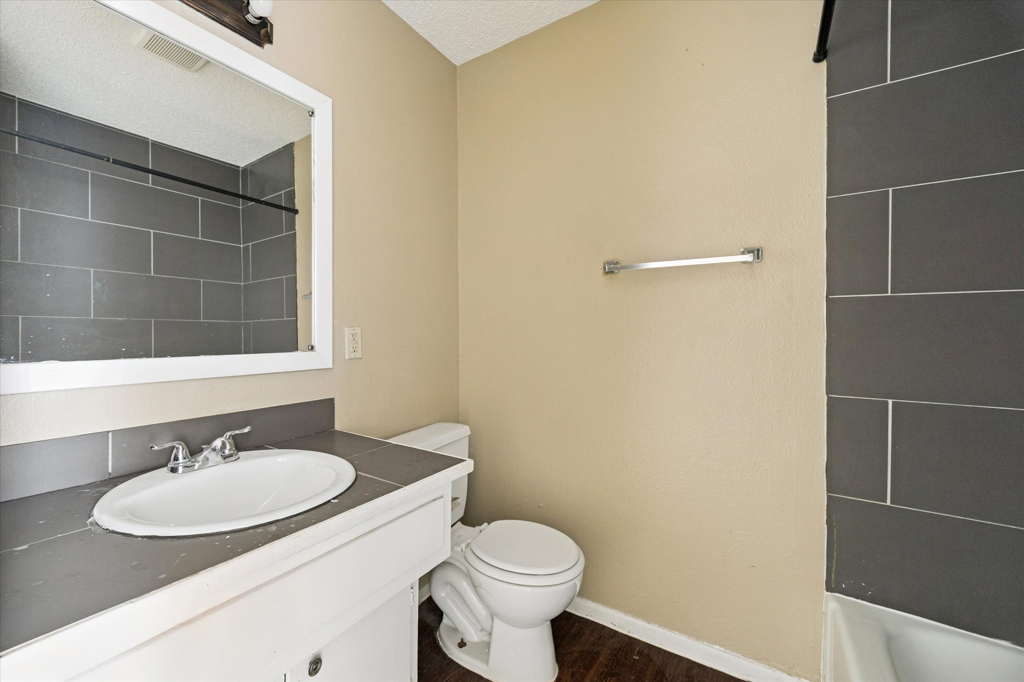 908 Kirschner Place, Unit B Austin, TX 78758 - Photo 7 of 10 a bathroom with a sink toilet and a mirror