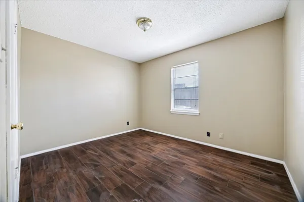 a view of cabinets and wooden floor