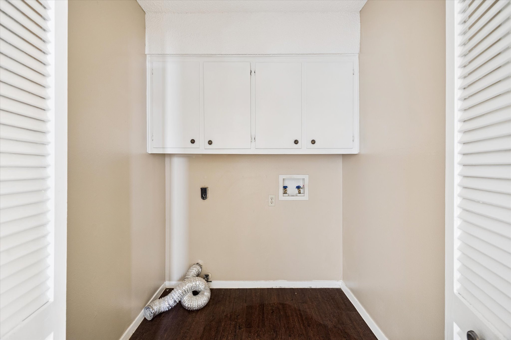 908 Kirschner Place, Unit B Austin, TX 78758 - Photo 9 of 10 a view of cabinets and wooden floor