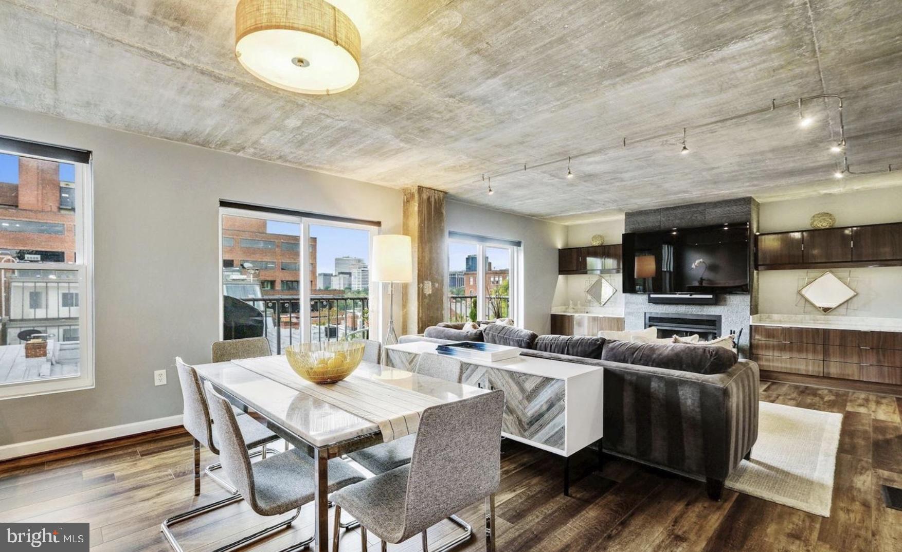 3210 Grace Street Northwest, Unit 308 Washington, DC 20007 - Photo 3 of 11 a view of a dining room with furniture window and wooden floor