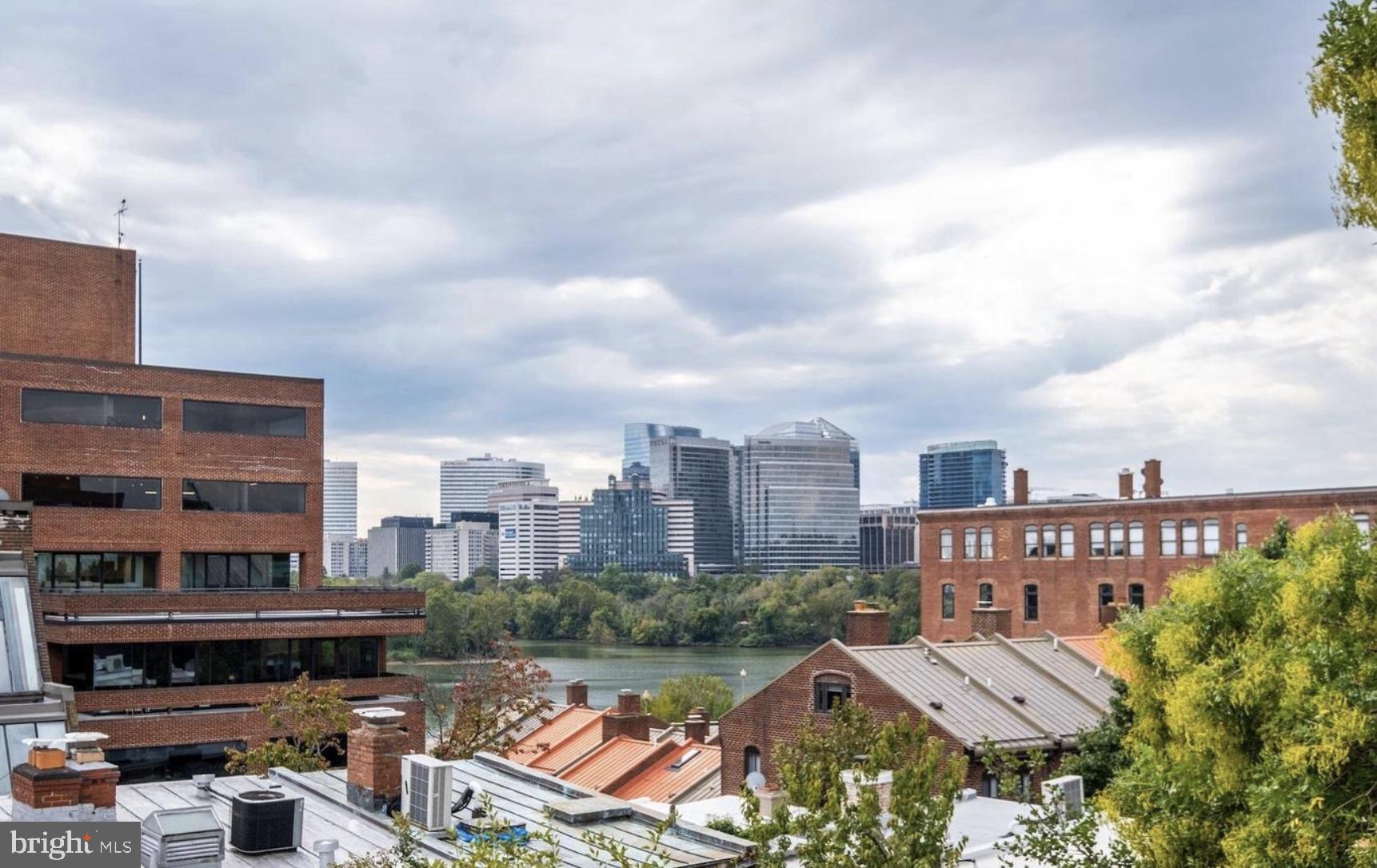 3210 Grace Street Northwest, Unit 308 Washington, DC 20007 - Photo 7 of 11 a view of a city with tall buildings