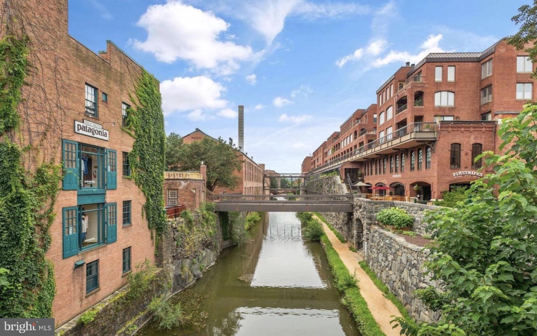 3210 Grace Street Northwest, Unit 308 Washington, DC 20007 - Photo 9 of 11 a view of buildings with a swimming pool