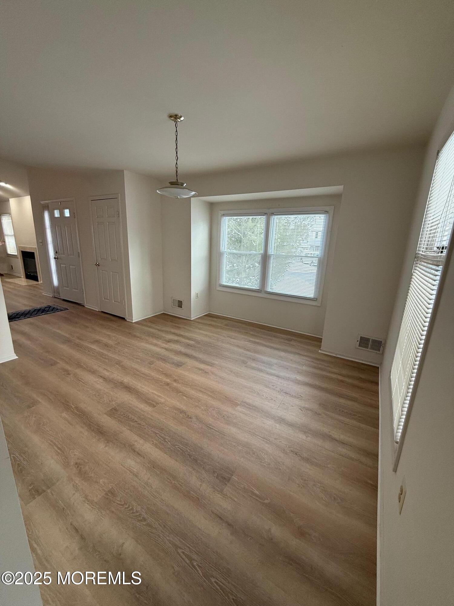 2 Whitesands Way Little Silver, NJ 07739 - Photo 6 of 9 an empty room with wooden floor and windows