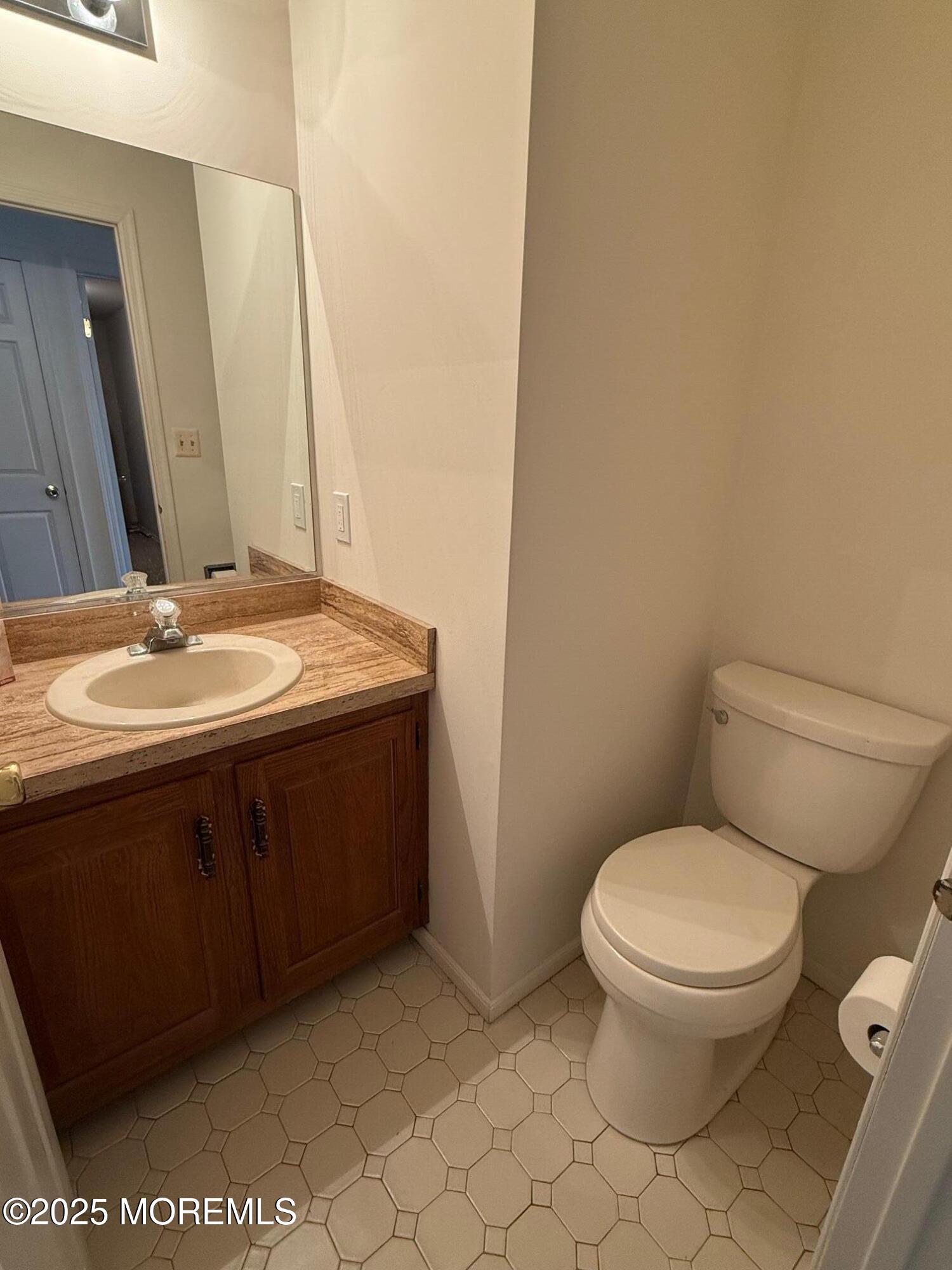 2 Whitesands Way Little Silver, NJ 07739 - Photo 9 of 9 a bathroom with a granite countertop toilet and a sink