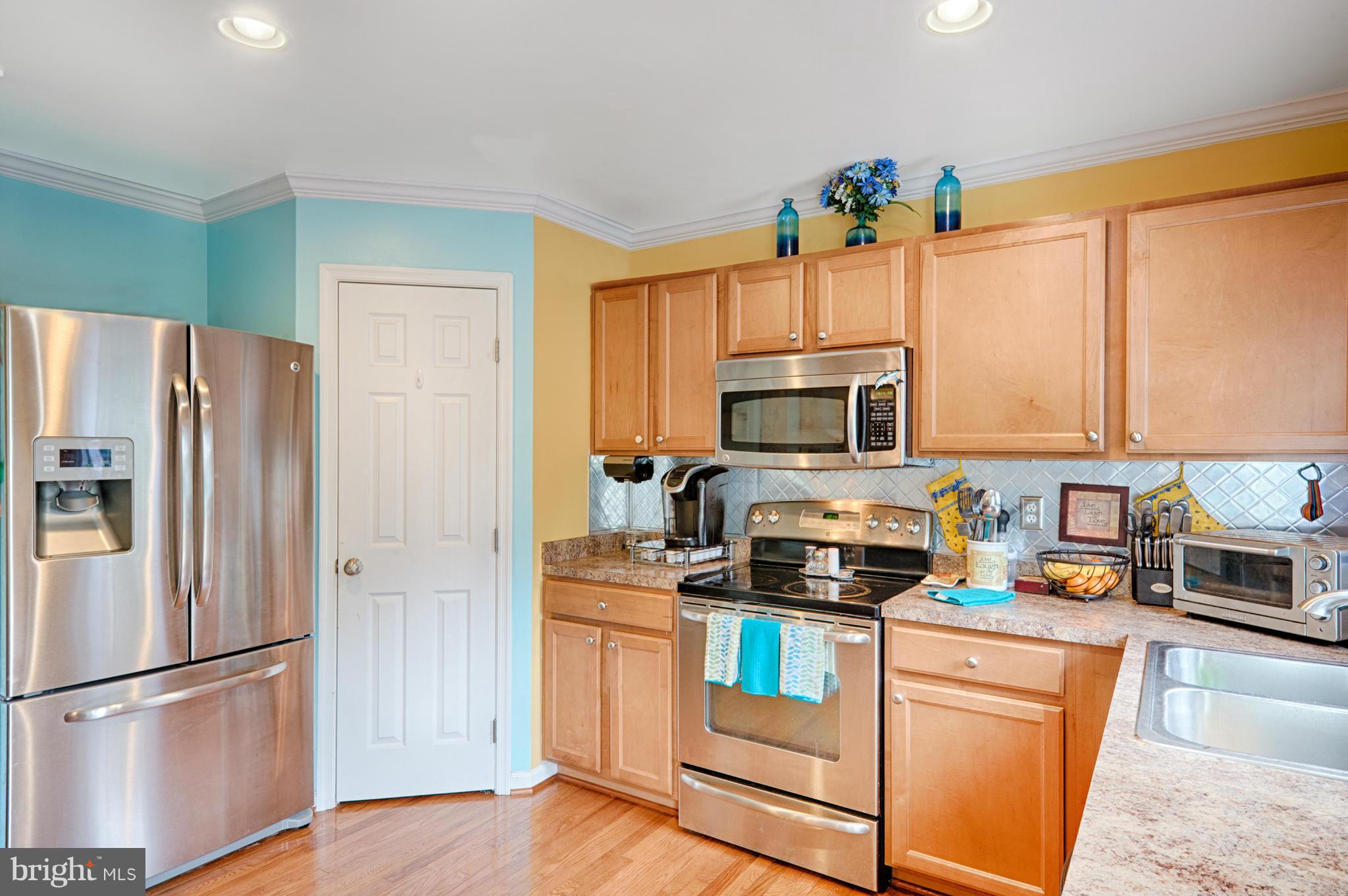 59 Haverhill Road Joppa, MD 21085 - Photo 11 of 28 a kitchen with stainless steel appliances a refrigerator stove and microwave