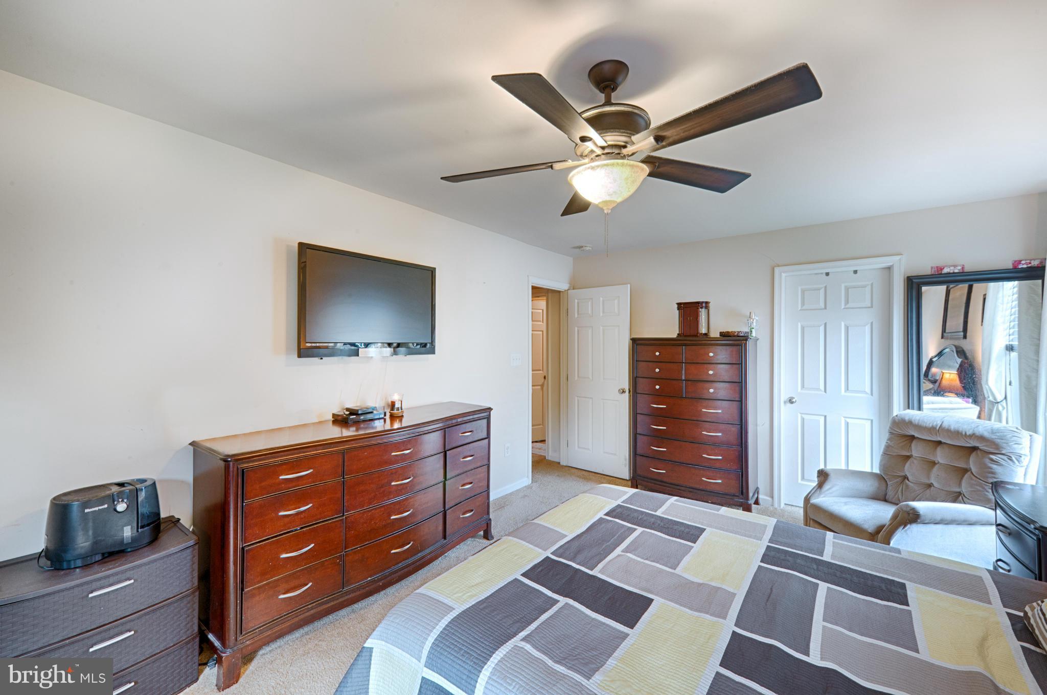 59 Haverhill Road Joppa, MD 21085 - Photo 14 of 28 a room with a dresser and a flat screen tv