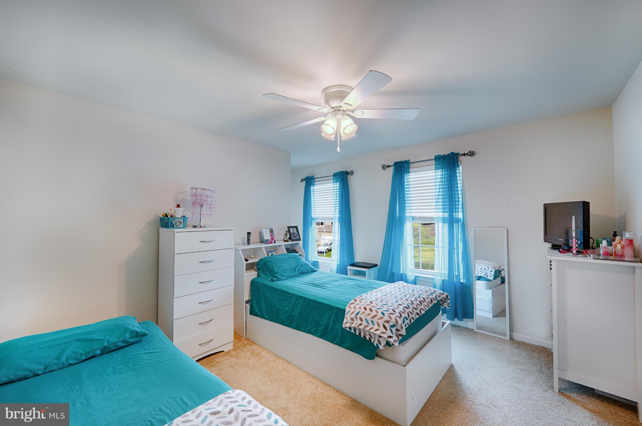 59 Haverhill Road Joppa, MD 21085 - Photo 17 of 28 a bedroom with a bed and a chandelier