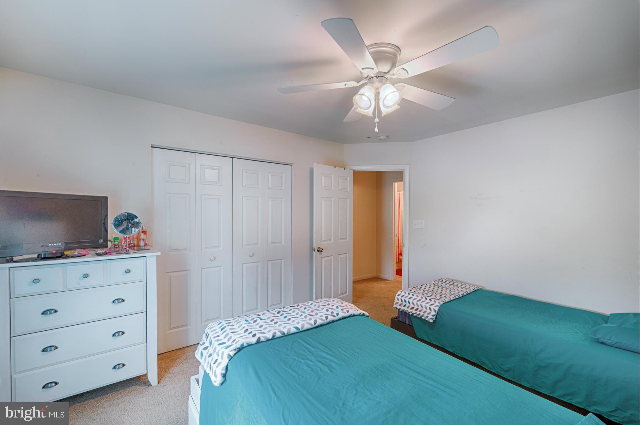 59 Haverhill Road Joppa, MD 21085 - Photo 18 of 28 a bedroom with a bed and a chandelier fan