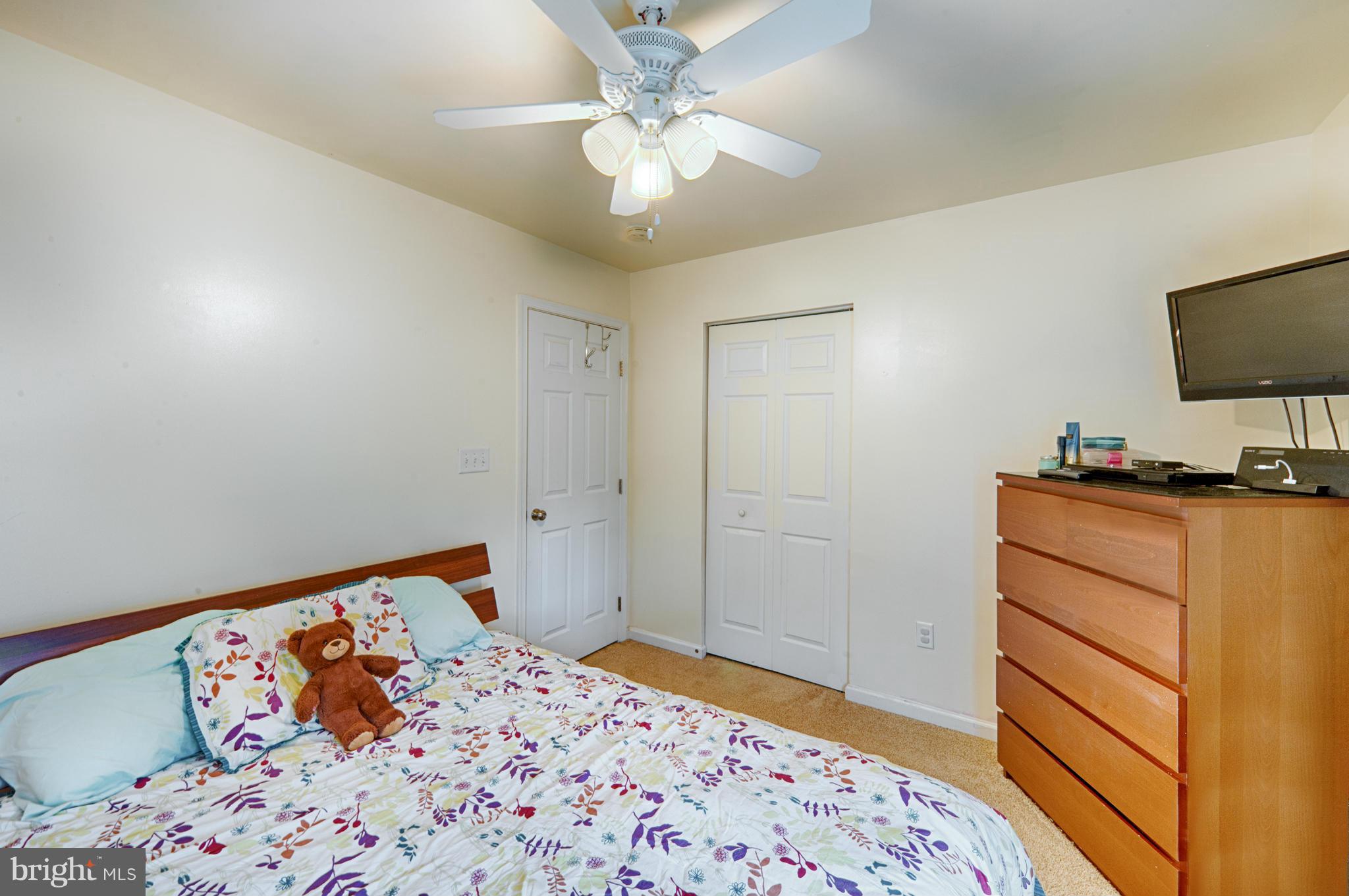 59 Haverhill Road Joppa, MD 21085 - Photo 20 of 28 a bedroom with a bed and a flat screen tv