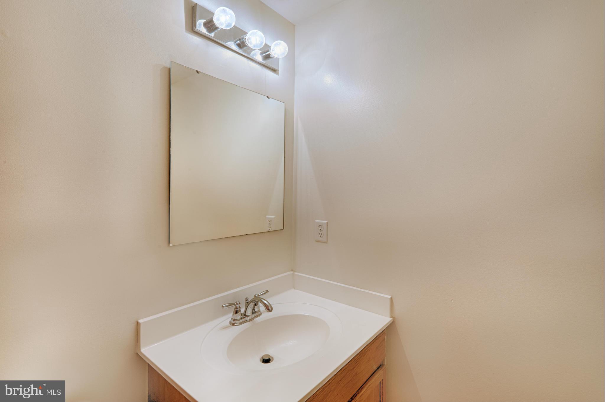 59 Haverhill Road Joppa, MD 21085 - Photo 21 of 28 a bathroom with a sink and a mirror